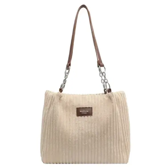 Beige corduroy tote bag with brown leather straps and silver chain accents.