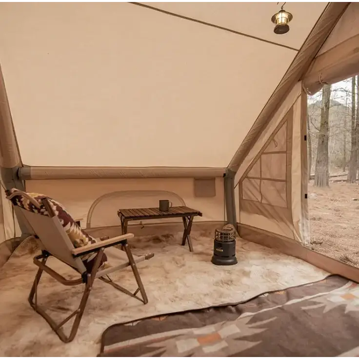 Beige canvas tent with reinforced seams and a mesh window panel.