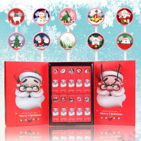 Red christmas-themed gift box featuring a cartoon santa claus design with glasses and white beard, containing twelve individually wrapped chocolate candies in clear circular windows.