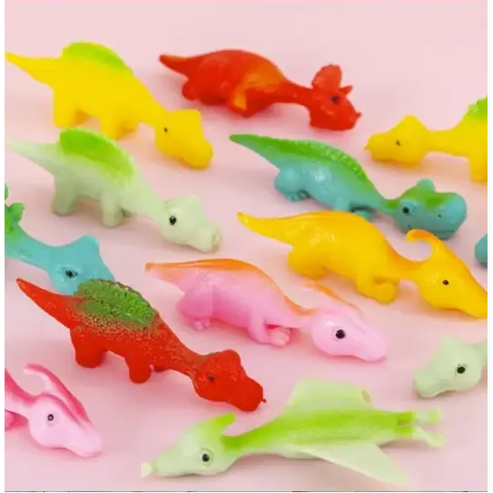 A collection of colorful, plastic dinosaur figurines in various shapes and vibrant hues.