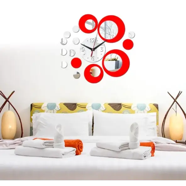 Red circular mirror clock with silver accents and reflective surfaces.