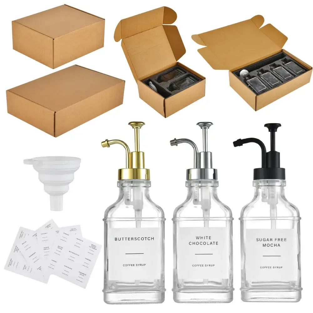 Set of three clear glass syrup dispensers with gold, silver, and black pump tops.