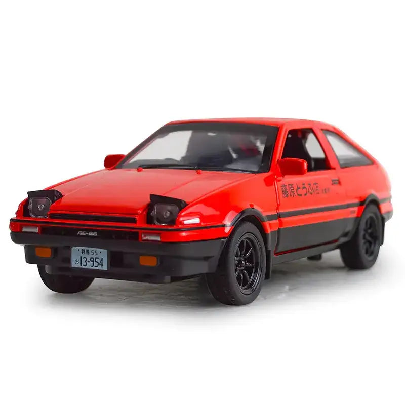 Red and black diecast model of a toyota ae86 with detailed decals.