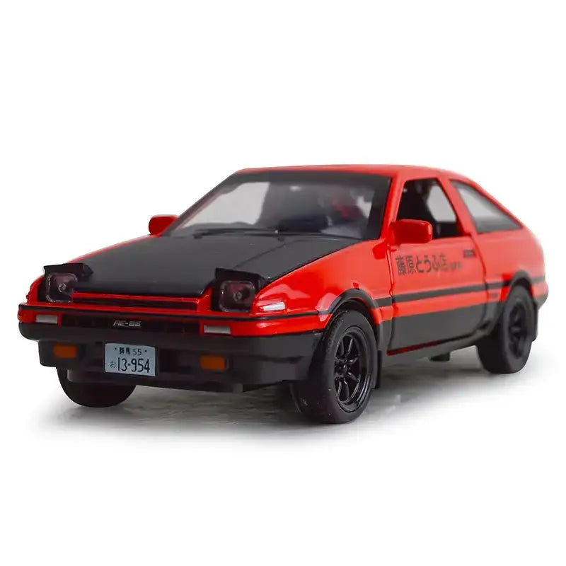 Red and black diecast model of a toyota ae86 with ’藤原とうふ’ decals.