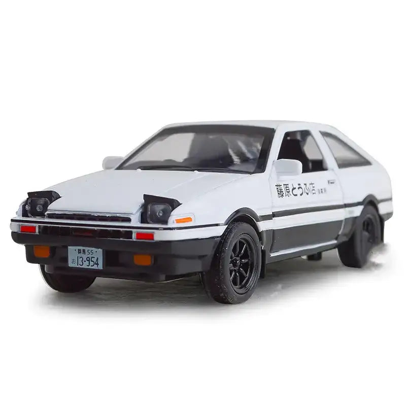 White and black diecast model of a toyota ae86 with ’藤原とうふ店’ lettering on the side.