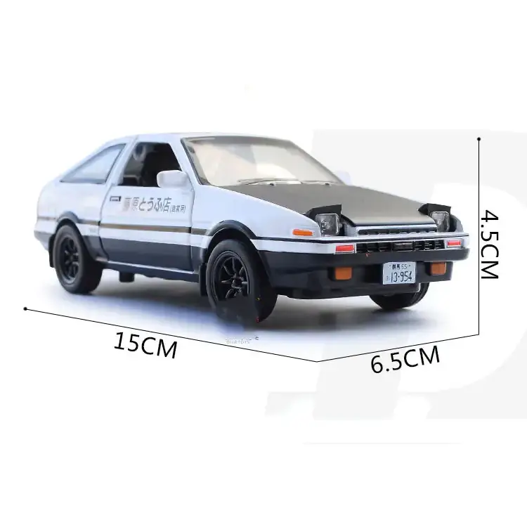 White and black diecast model of a toyota ae86 with racing decals.