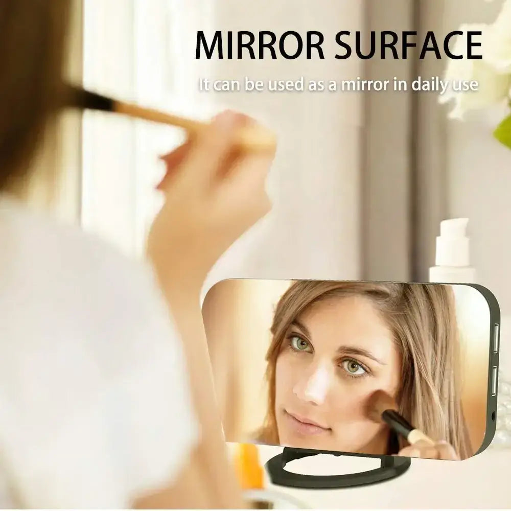 Compact rectangular mirror with a sleek black frame and smooth, reflective surface.
