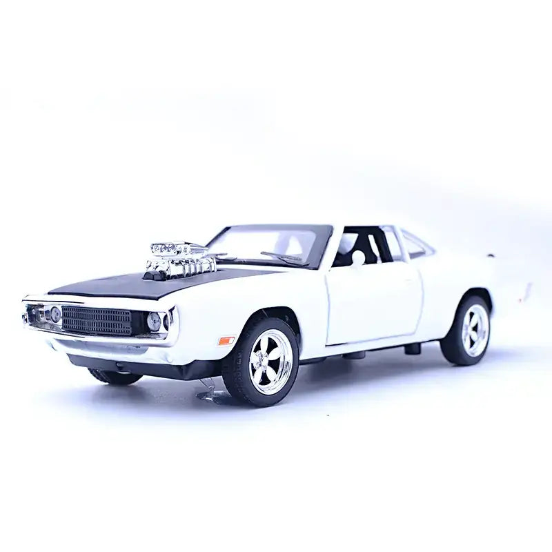 White die-cast model of a classic muscle car with black hood and chrome details.