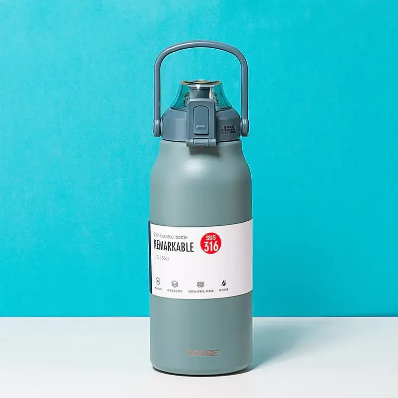 Gray stainless steel water bottle with a handle and lid, featuring a white label that reads ’remarkable’ and indicates it’s made of sus 316 material.