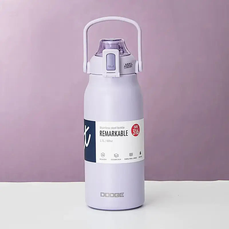 A lavender-colored stainless steel water bottle with a white handle and lid, featuring the brand name ’dodge’ on its base.
