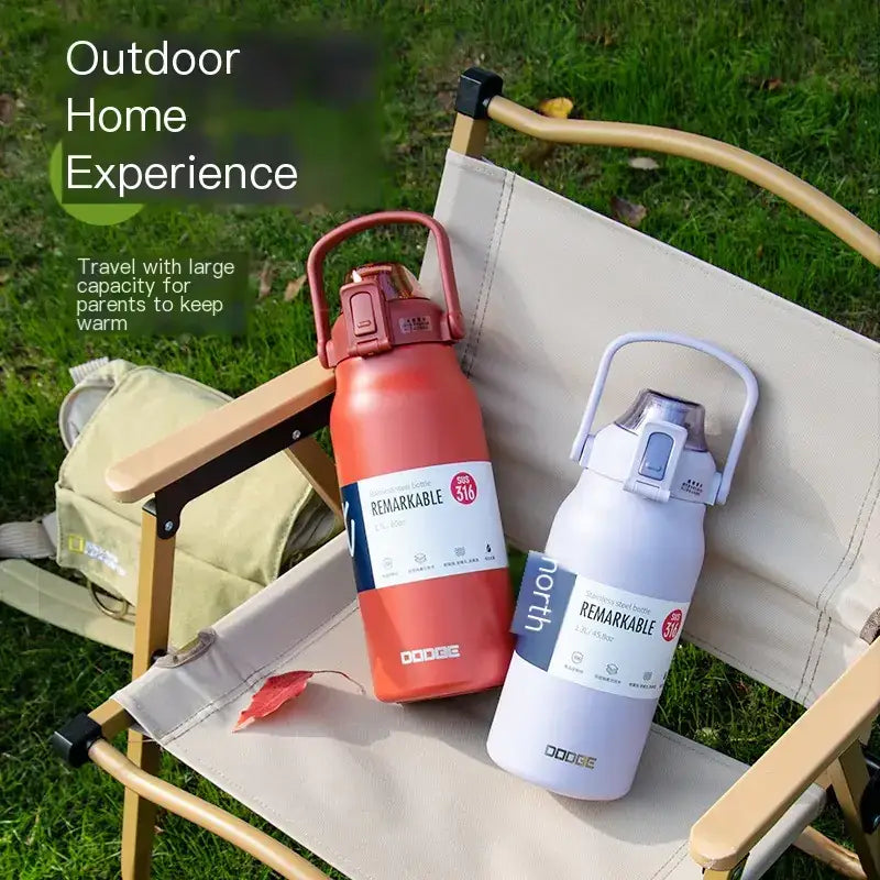 Two insulated water bottles, one in vibrant red and the other in sleek white, both featuring sturdy handles and modern designs with ’remarkable’ branding.