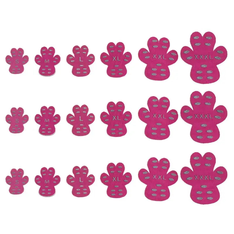 Pink paw-shaped grip pads in sizes s through xxxl, featuring gray textured suction cups on the soles.