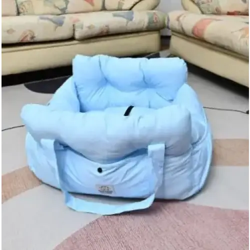 Light blue, plush pet carrier with soft fabric and padded handles.