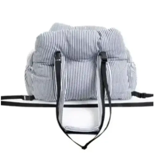 A plush, striped pet carrier with black straps and a soft fabric exterior.