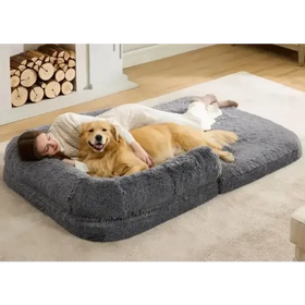 Gray plush pet bed with soft, cushioned edges and a cozy, rectangular shape