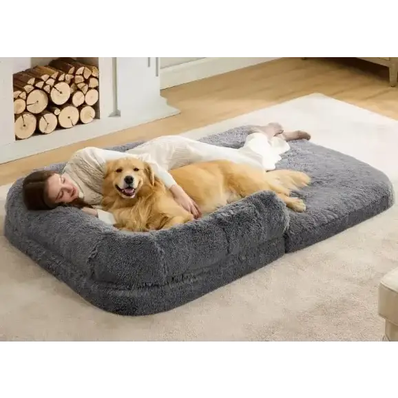 Gray plush pet bed with soft, cushioned edges and a cozy, rectangular shape