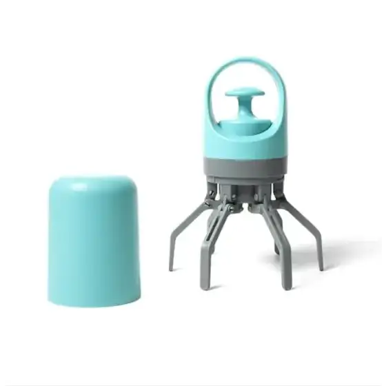 A turquoise and gray portable vacuum cleaner with a handle, four articulated legs for mobility, and an attached cylindrical container.