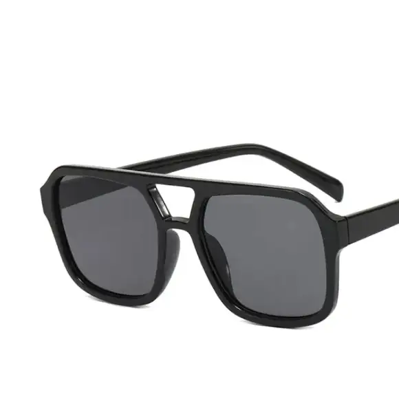 Black aviator-style sunglasses with dark gray lenses and a sleek, modern frame.