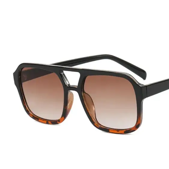 Black and tortoiseshell acetate sunglasses with gradient brown lenses.
