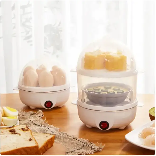 White electric egg cooker with transparent dome lid and dual-tiered design