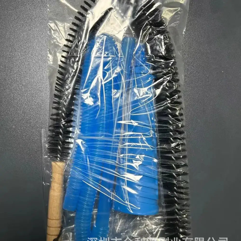 Blue plastic and black bristle cleaning brushes in a clear plastic bag.