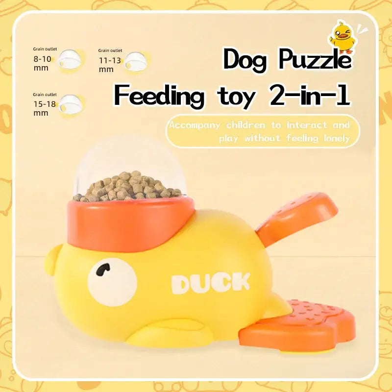 Yellow duck-shaped dog puzzle feeding toy with orange accents and a transparent dome.