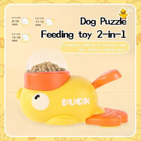 Yellow duck-shaped dog puzzle feeding toy with orange accents and a transparent dome.