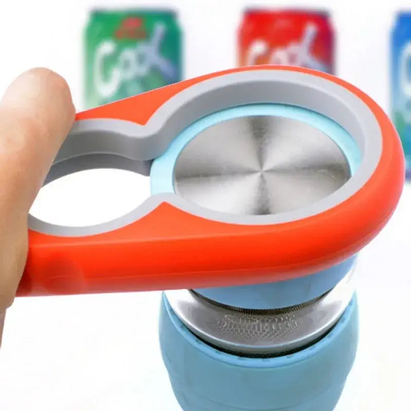 Orange and gray can opener with a metallic center ring, designed for easy opening of beverage cans.