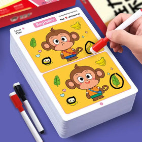 A stack of yellow beginner-level concentration training cards featuring cartoon monkeys and bananas, with a hand using a red marker to highlight differences.
