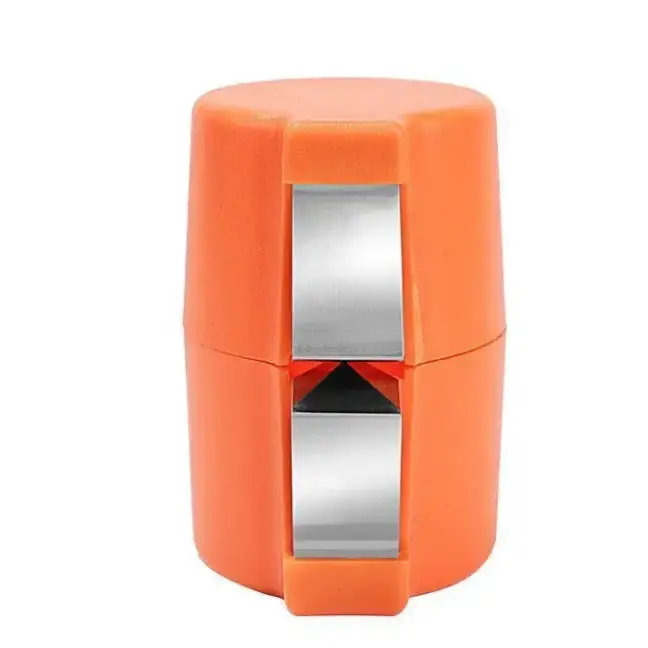 Bright orange plastic pencil sharpener with a metallic silver blade and black triangular cutting mechanism.