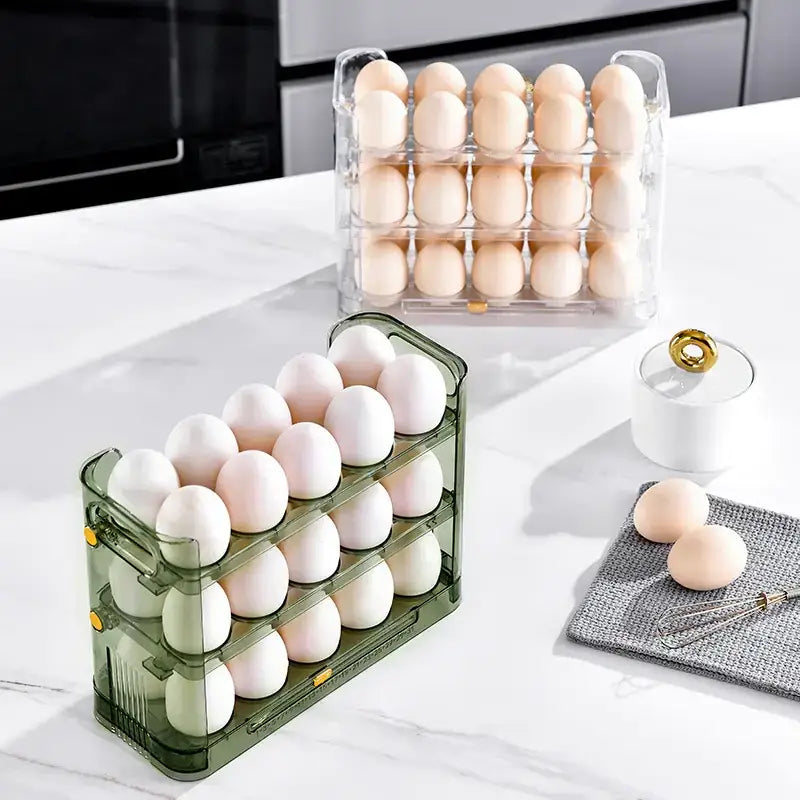 Transparent and olive green plastic egg carton with three tiers, each holding a dozen eggs.