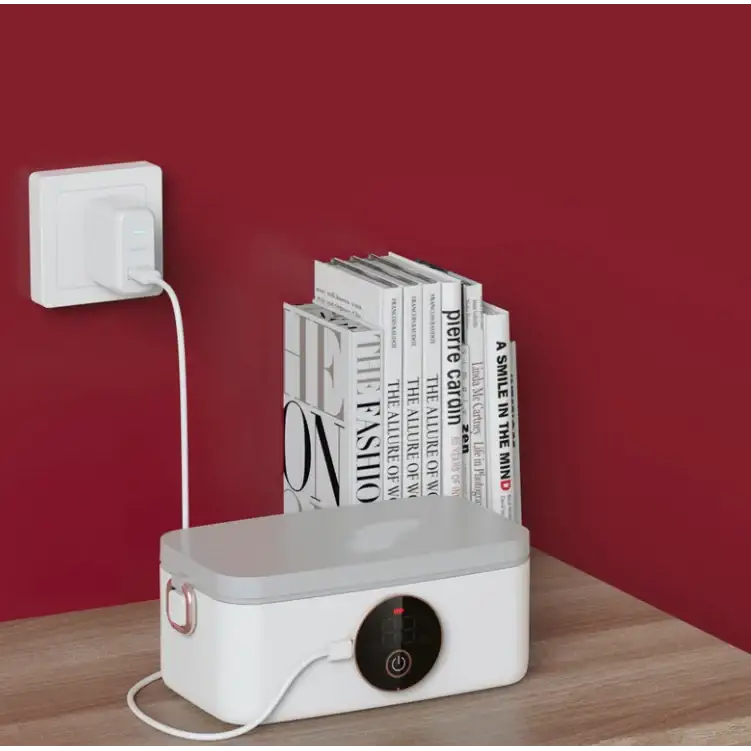 White rectangular electric rice cooker with a black circular control panel and red power indicator, featuring a lid handle on the side.