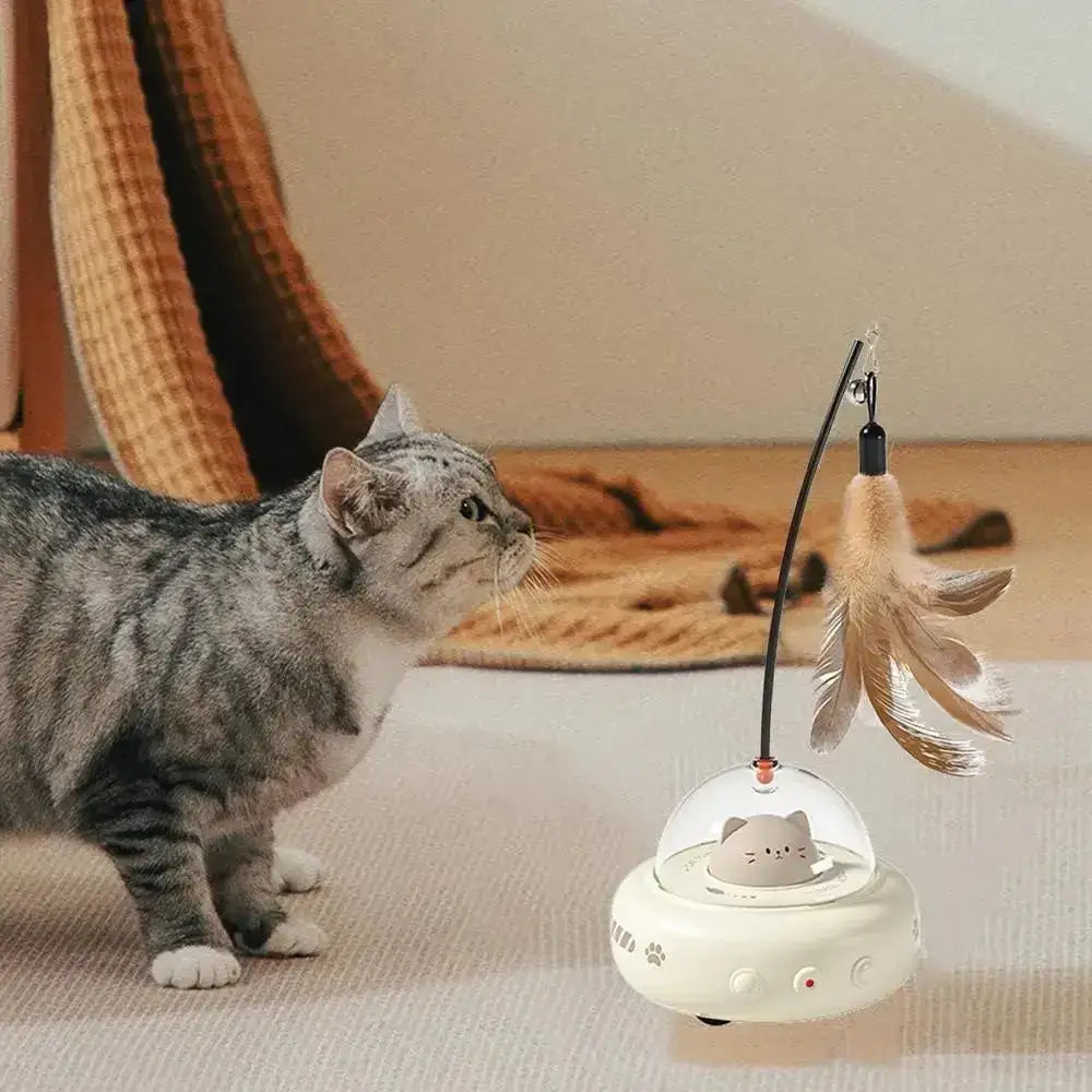White cat-shaped toy with a clear dome and feather wand attachment