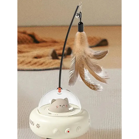 A white, ufo-shaped cat toy with a clear dome housing a gray cartoon cat figure and featuring paw print decals on its base.