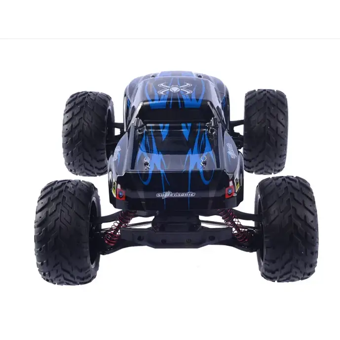 Black and blue remote-controlled monster truck with flame decals and red suspension springs.
