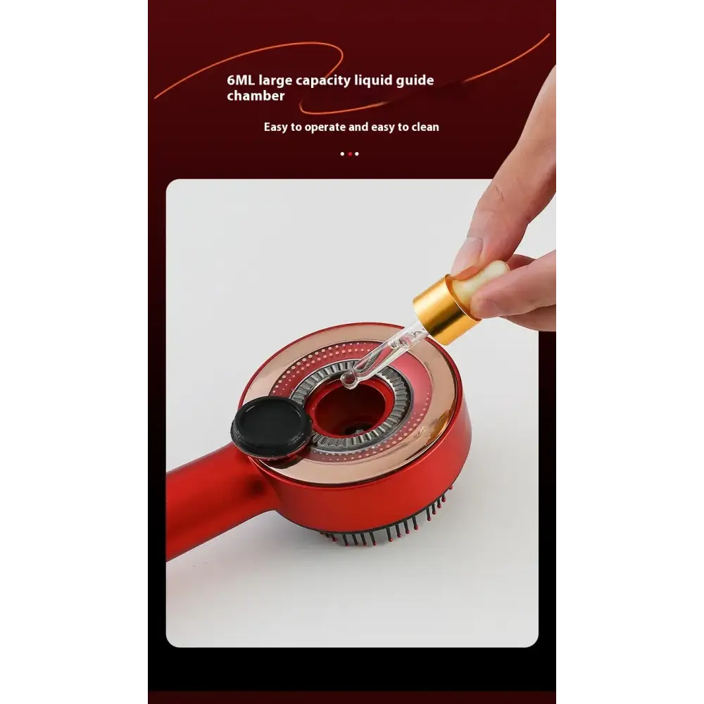 Red hair dryer with a gold-toned liquid guide chamber and black cap.