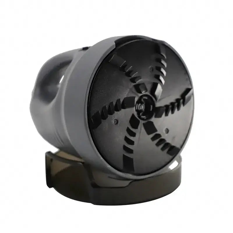 Black plastic kitchen gadget with a circular, cross-shaped blade assembly and a handle for manual operation.