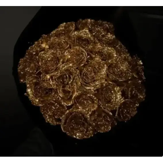 A bouquet of golden, glittery roses arranged in a circular pattern.