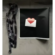 Black lanyard with white text reading ’you are not alone’