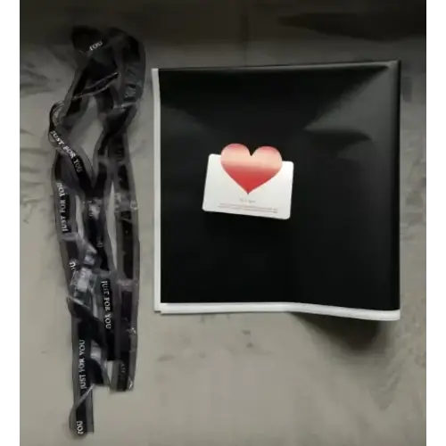 Black lanyard with white text reading ’you are not alone’