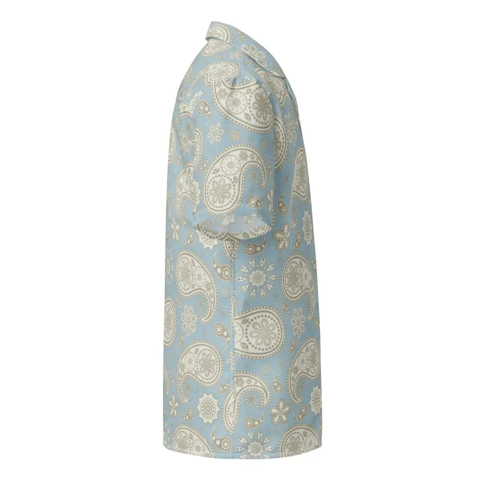 A light blue blouse featuring an intricate beige paisley pattern with floral accents.