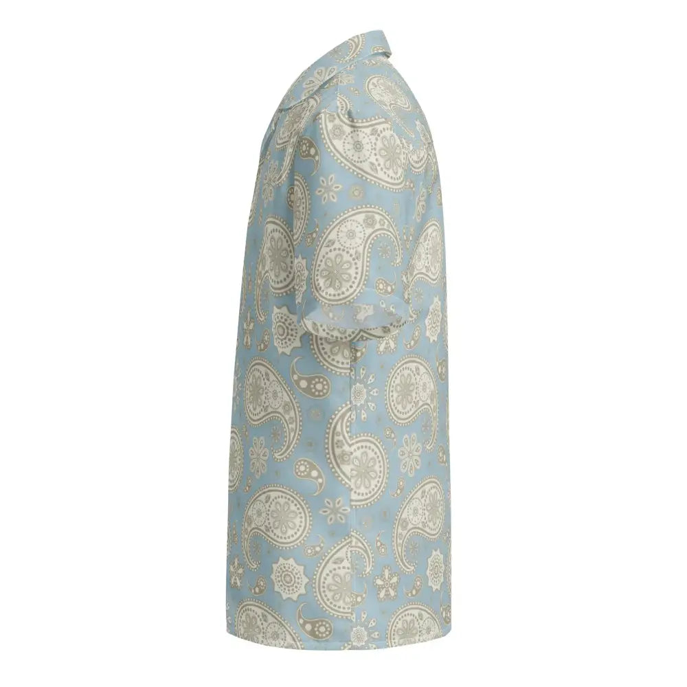 A light blue short-sleeved button-up shirt featuring an intricate beige paisley pattern.