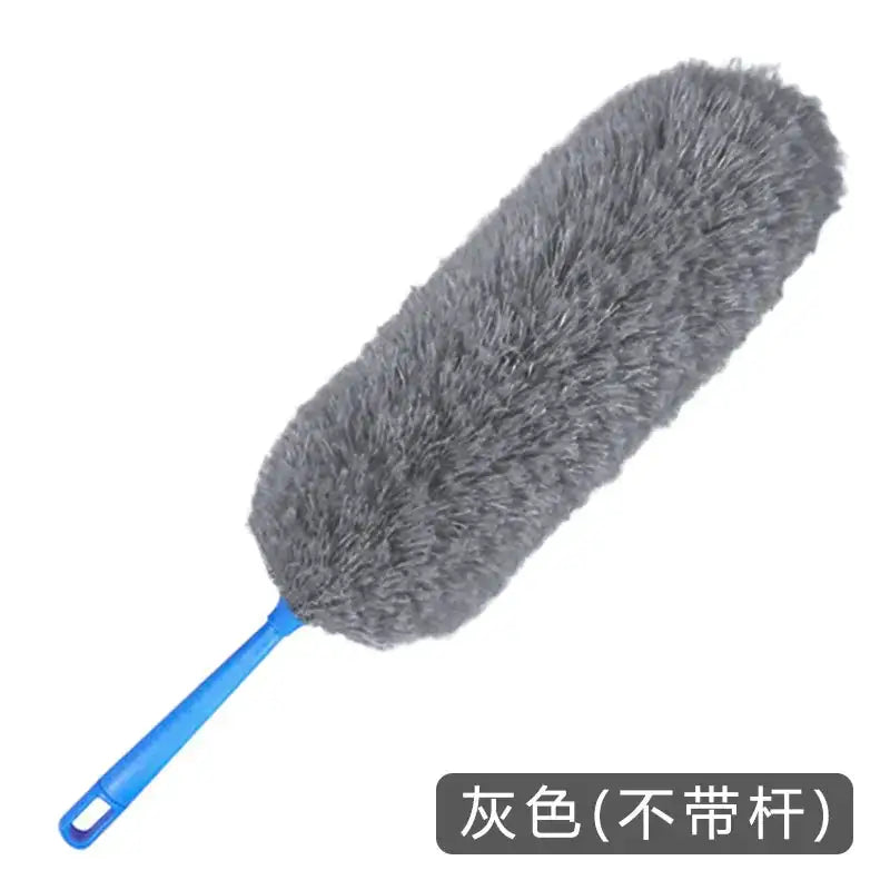 Gray fuzzy duster with a blue plastic handle.