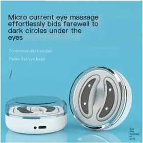 White and silver micro current eye massage device with a sleek, circular design featuring two curved electrode pads.