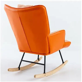 Vibrant orange upholstered rocking chair with black metal frame and light wood rockers.