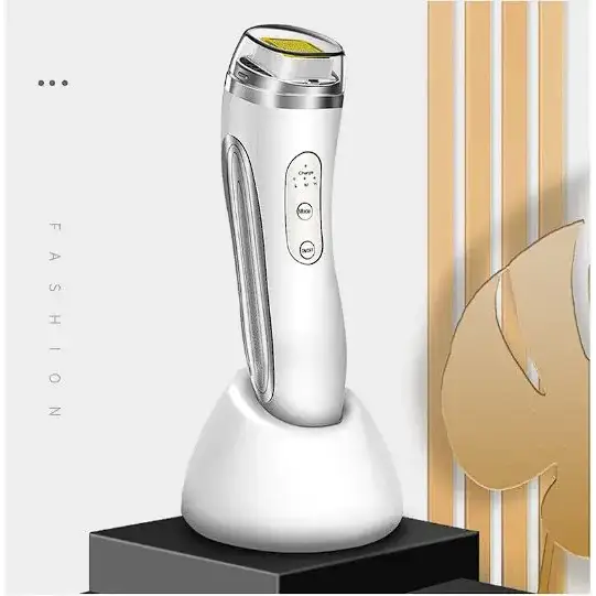 White and silver handheld facial device with a sleek, ergonomic design featuring three control buttons on the side.