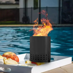 Black cylindrical fire pit with perforated base and flames burning inside