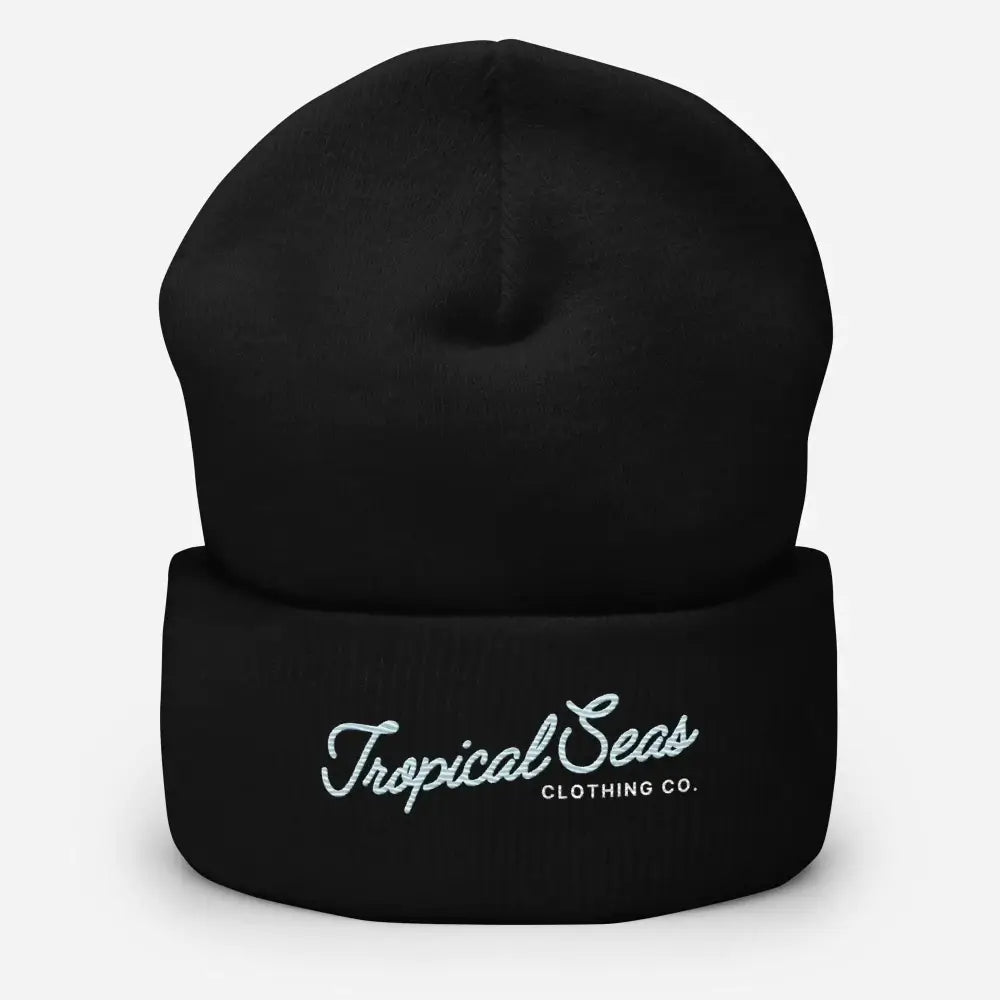 Black knit beanie with white embroidered ’tropical seas clothing co.’ logo on the cuff.