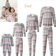 Christmas-themed family pajama set with red reindeer, green trees, and white snowflake patterns on a light gray background.