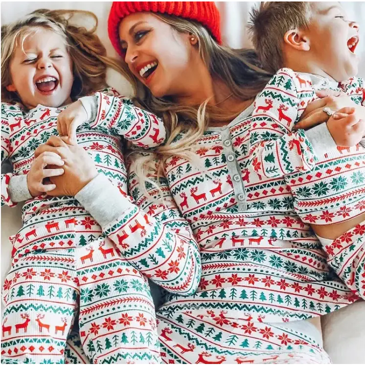 Red, green, and white christmas-themed pajama set with reindeer and snowflake patterns.